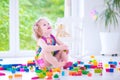 Adorable girl playing with blocks Royalty Free Stock Photo