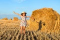 Adorable girl in rye field on sunset with a basket of bread Royalty Free Stock Photo