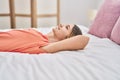 Adorable girl smiling confident lying on bed at bedroom Royalty Free Stock Photo