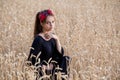 Adorable girl standing on wheat field Royalty Free Stock Photo