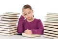 Adorable girl tired with many books