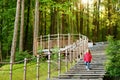 Adorable girl walking down stairs in summer park Royalty Free Stock Photo