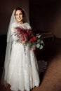 Adorable gorgeous happy bride holding big wedding bouquet, posing. Beautiful pretty woman smiling, excited about Royalty Free Stock Photo