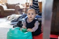 Adorable happy baby playing in the living room