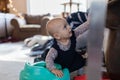 Adorable happy baby playing in the living room