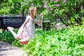 Adorable happy little girl with basket in lilac Royalty Free Stock Photo