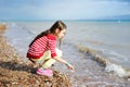 Adorable happy little girl on beach vacation