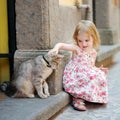 Adorable happy little girl and a cat Royalty Free Stock Photo