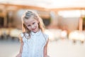 Adorable happy little girl outdoors in italian city. Portrait of caucasian kid enjoy summer vacation in Rome Royalty Free Stock Photo