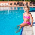 Adorable happy little girl in the swimming pool Royalty Free Stock Photo