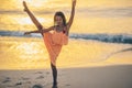 Adorable happy little girl on white beach at sunset. Royalty Free Stock Photo