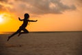 Adorable happy little girl on white beach at sunset. Royalty Free Stock Photo