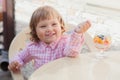 Little girl eating fruit salad. Royalty Free Stock Photo