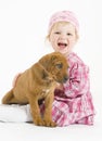 Adorable and happy smiling girl little puppy Royalty Free Stock Photo