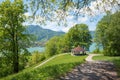 Adorable hiking destination above lake Tegernsee, with gazebo, view through green branches Royalty Free Stock Photo