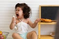 Adorable hispanic baby Crying upset when finished eating in the table