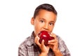 Adorable Hispanic Boy Eating a Large Red Apple Royalty Free Stock Photo