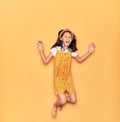 Adorable hispanic child girl wearing casual dress and diadem smiling happy