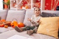 Adorable hispanic girl having halloween party playing with soap bubbles at home Royalty Free Stock Photo