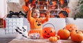 Adorable hispanic girl having halloween party playing with soap bubbles at home Royalty Free Stock Photo