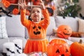 Adorable hispanic girl having halloween party playing with soap bubbles at home Royalty Free Stock Photo