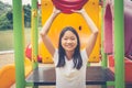 Adorable and Holiday Concept : Cute little child feeling funny and happiness on playground.