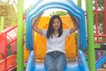 Adorable and Holiday Concept : Shoot Asian woman feeling funny and happiness on playground.