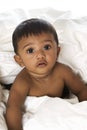 Adorable Indian baby lying on blanket