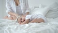 Adorable Infant Baby Girl Lying On The Bed And Having A Rest