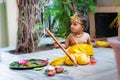 adorable infant dressed as hindu god krishna cute facial expression with flute at janmashtami