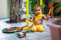 adorable infant dressed as hindu god krishna cute facial expression with flute at janmashtami