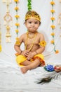 adorable infant dressed as hindu god krishna on the occasion of janmashtami celebrated at india