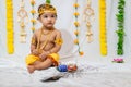 adorable infant dressed as hindu god krishna on the occasion of janmashtami celebrated at india