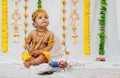 adorable infant dressed as hindu god krishna on the occasion of janmashtami celebrated at india