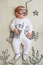 Adorable infant wearing flippers and mask as scuba diving