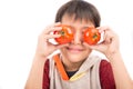 Adorable kid loving tomatoes