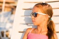 Adorable kid sunbathing on a beach