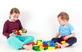 Adorable kids playing with blocks