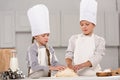 adorable kids preparing dough for cookies at table Royalty Free Stock Photo