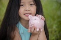 Adorable kids saving coins in piggy bank. Happy little investment saving money for happiness future. Girls smiling with happy Royalty Free Stock Photo