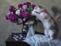 Adorable kitty and bouquet of flowers Royalty Free Stock Photo