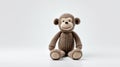 Adorable Knitted Monkey Toy On White Background