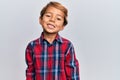 Adorable latin kid wearing casual clothes with a happy and cool smile on face