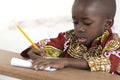 Adorable Little African Child Writing at School in Bamako, Mali