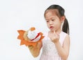 Adorable little Asian child girl hand wear and playing Lion puppets on white background. Educations concept