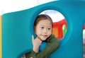 Adorable little Asian child girl playing toy playhouse at indoor playground Royalty Free Stock Photo