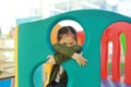 Adorable little Asian child girl playing toy playhouse at indoor playground Royalty Free Stock Photo