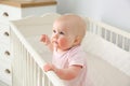 Adorable little baby with allergy in crib Royalty Free Stock Photo