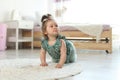 Adorable little baby girl crawling on floor Royalty Free Stock Photo