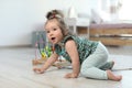 Adorable little baby girl crawling on floor Royalty Free Stock Photo